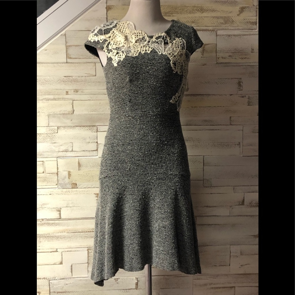 Blackish grey dress with mesh at top.